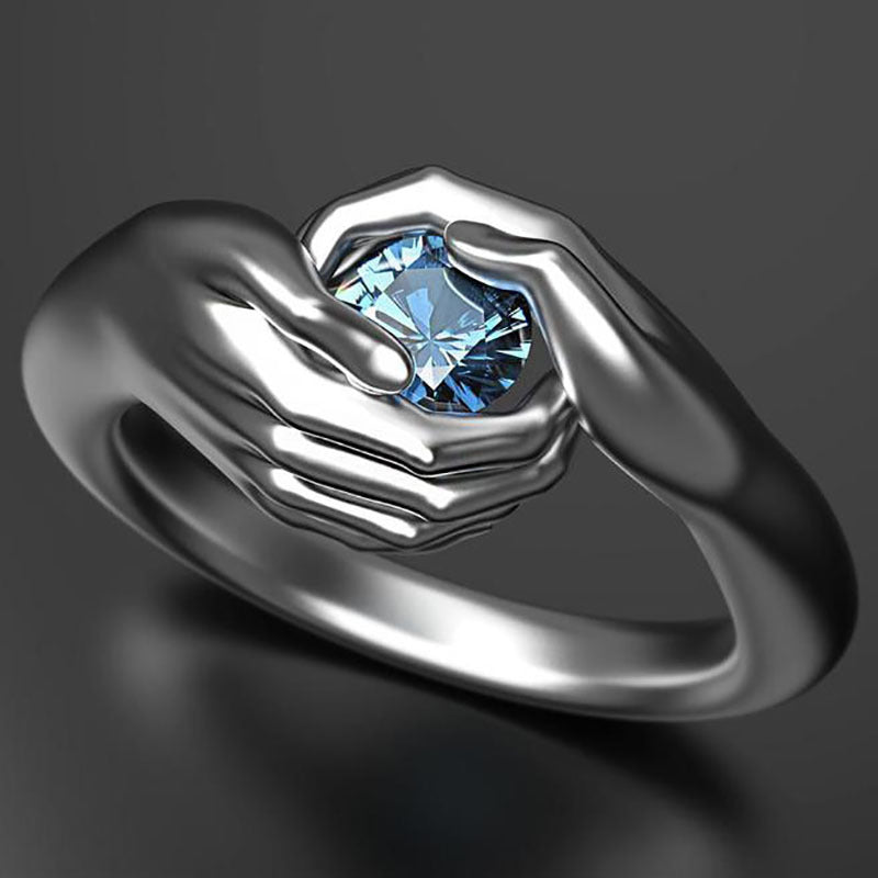 Hands Embracing Women's Ring
