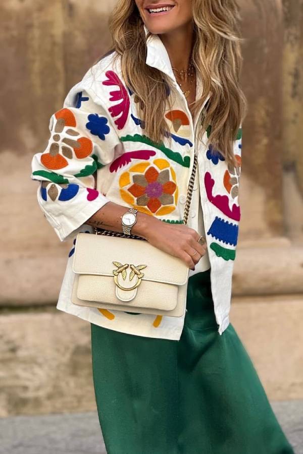 White denim overshirt embroidered with bright colors and pockets