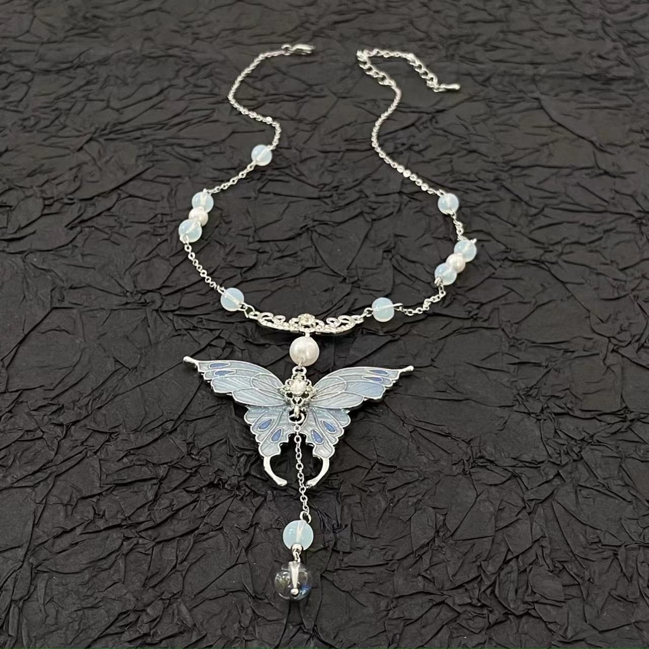 Blue butterfly pendant beaded necklace