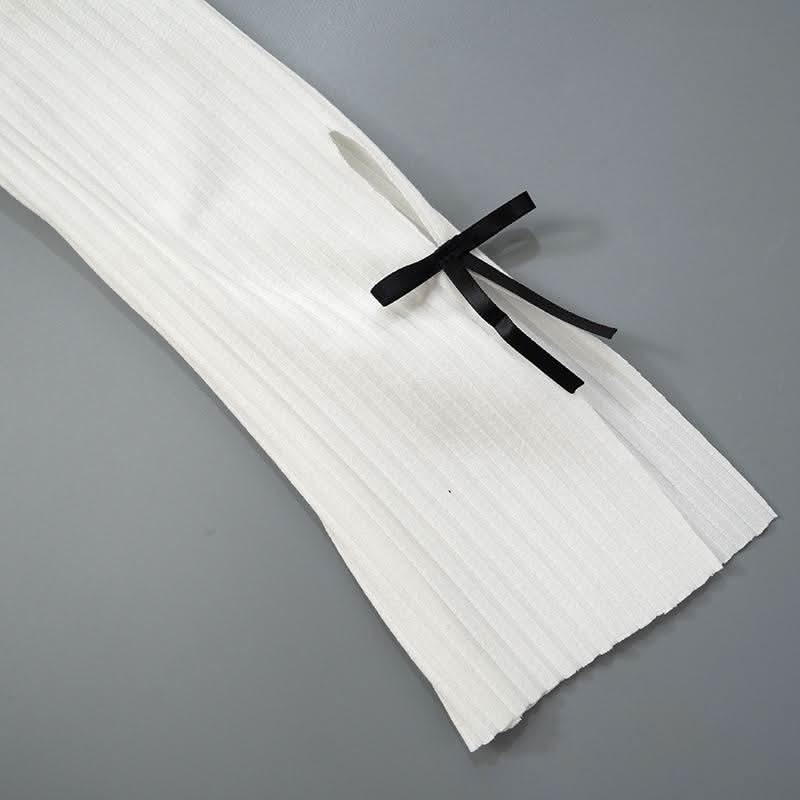 Long sleeve slit hollow out bowknot textured cut out top