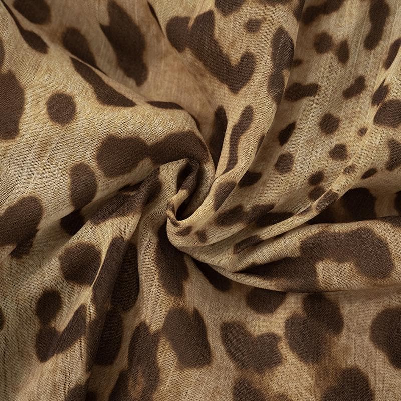 Halter cross front leopard print ruffle mini dress