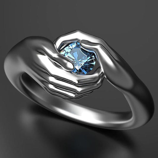 Hands Embracing Women's Ring