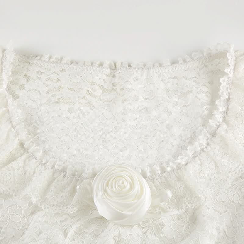 Long flared sleeve lace flower applique top