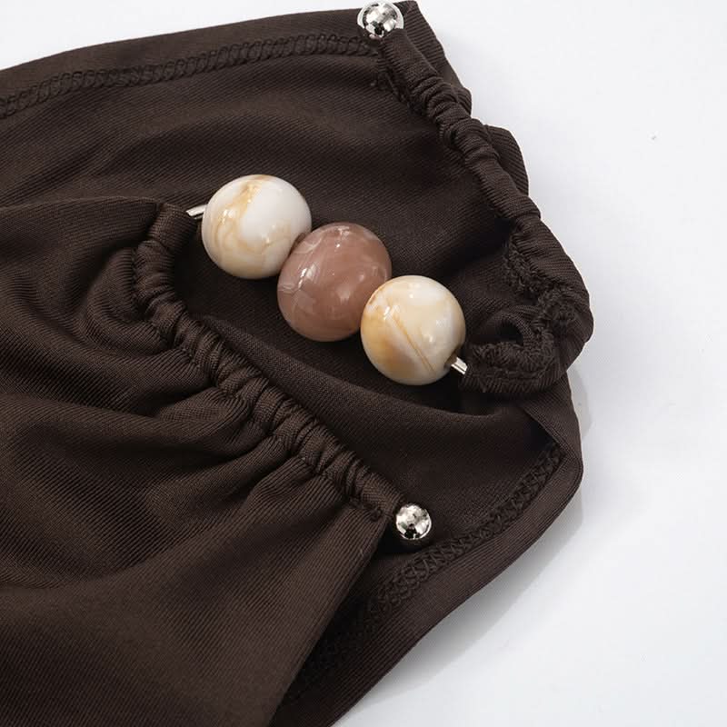 One shoulder irregular ruched beaded solid top