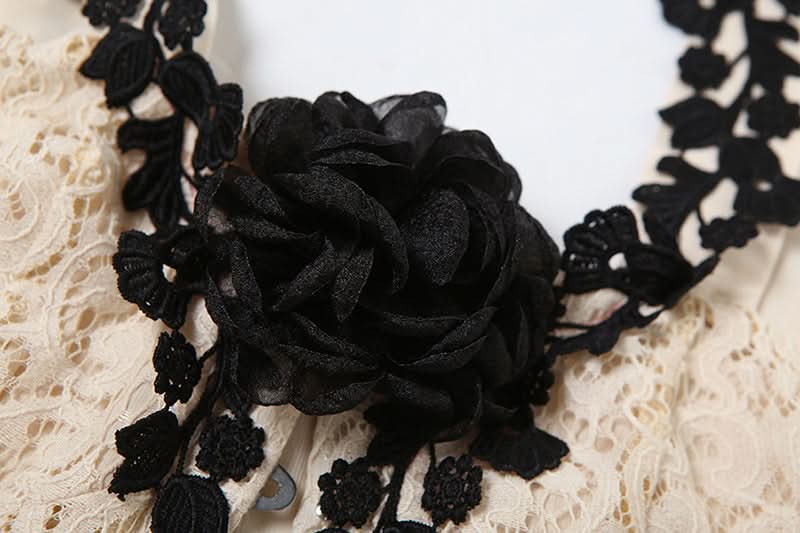 Off shoulder flower applique button top