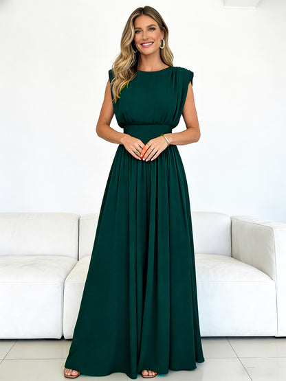 Chic Fitted Emerald Green Gown With Pleated Skirt Perfect For Formal Events