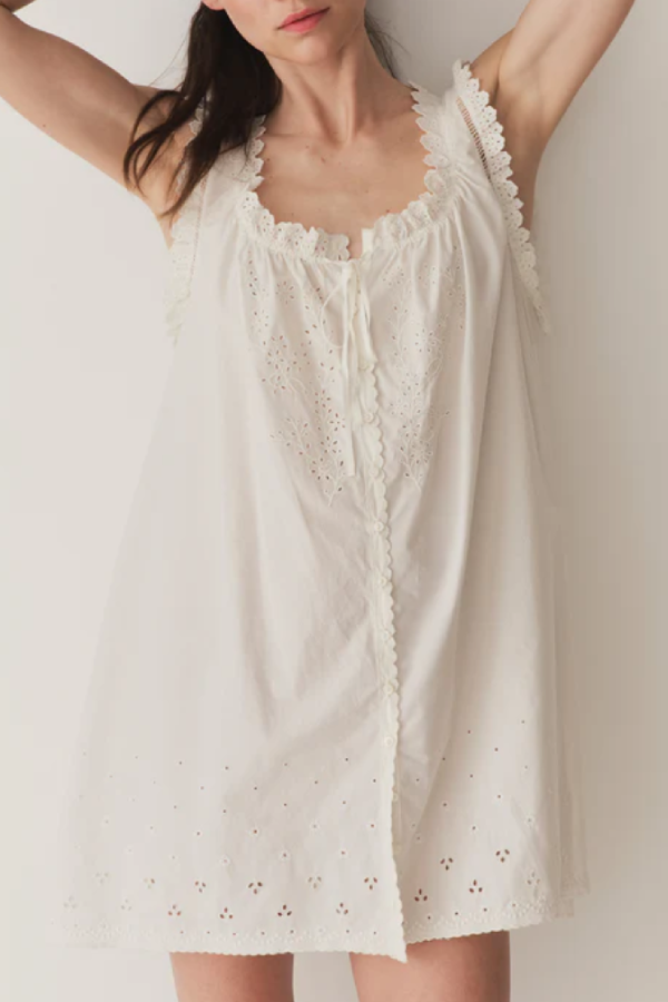 Short Skirt with Pearl Buttons and Scalloped Trim and Round Neck.