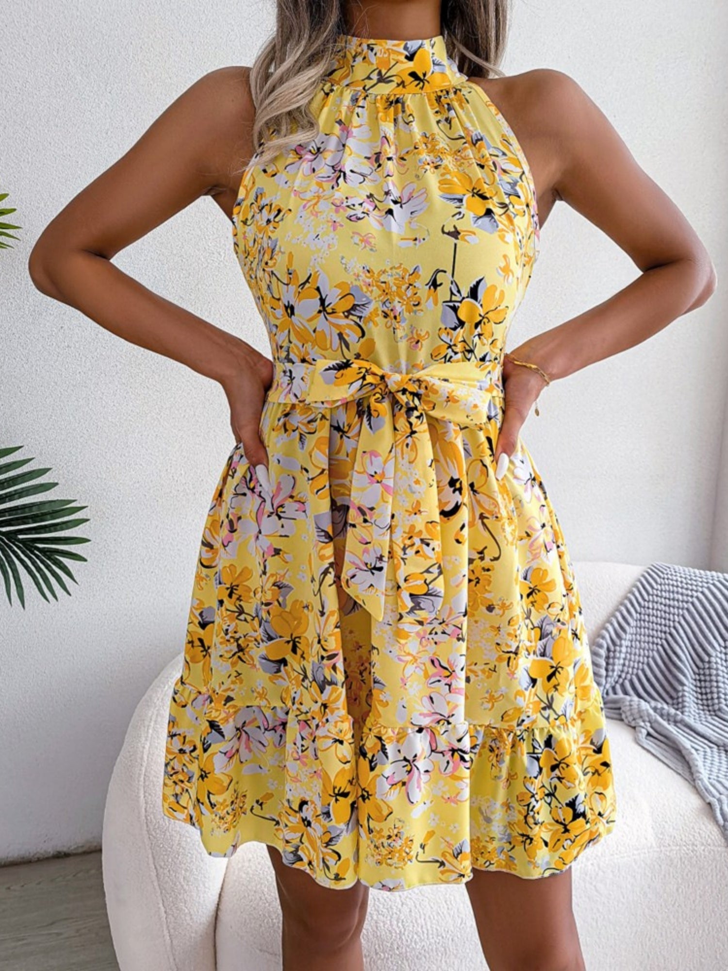 Printed Sleeveless Tie Mini Dress With A Full Skirt