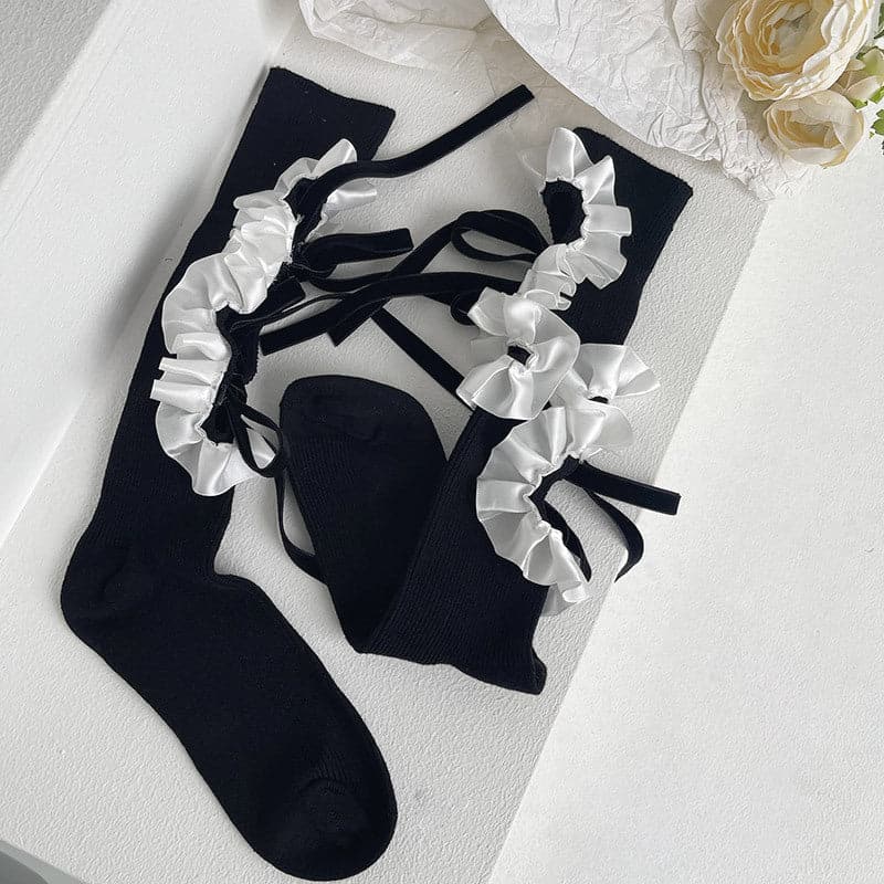 Hollow out bowknot ruffle irregular knee high socks
