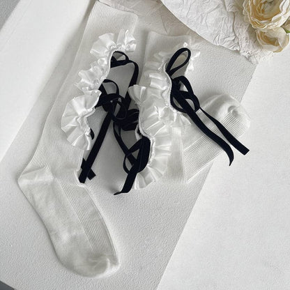 Hollow out bowknot ruffle irregular knee high socks