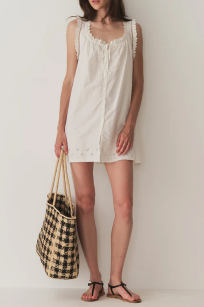 Short Skirt with Pearl Buttons and Scalloped Trim and Round Neck.