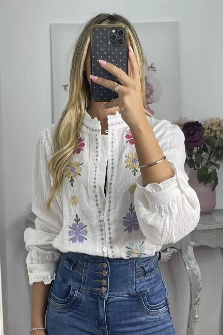 White shirt with colorful embroidered flowers