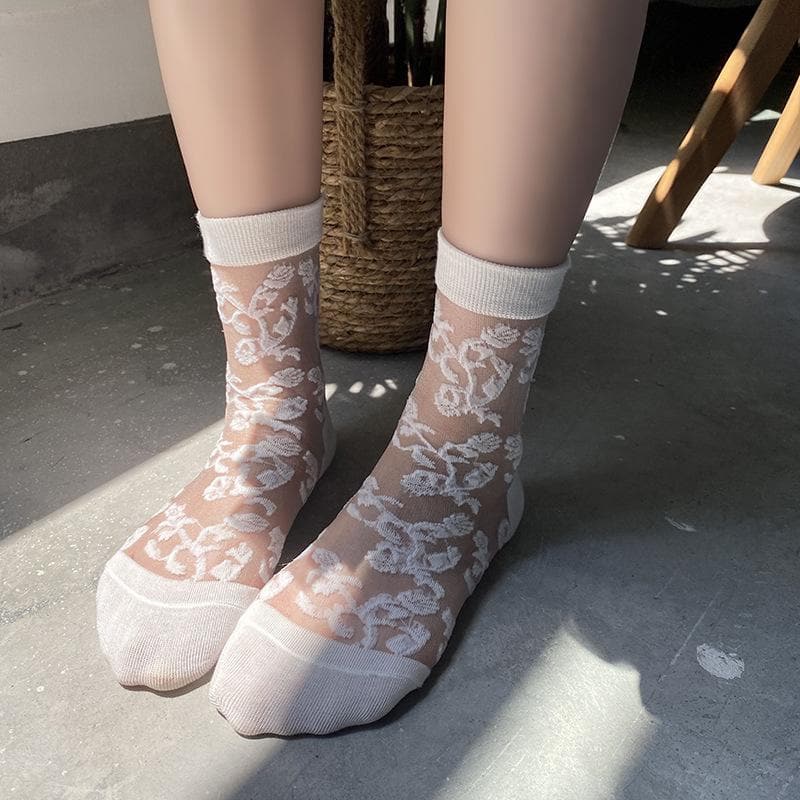 Solid flower pattern mesh long socks