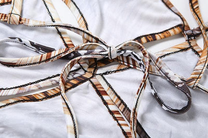 Hollow out snakeskin print halter self tie cut out maxi dress