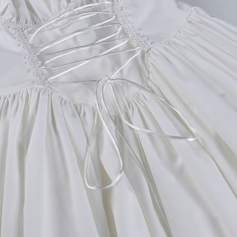 Long sleeve smocked lace up lace hem mini dress
