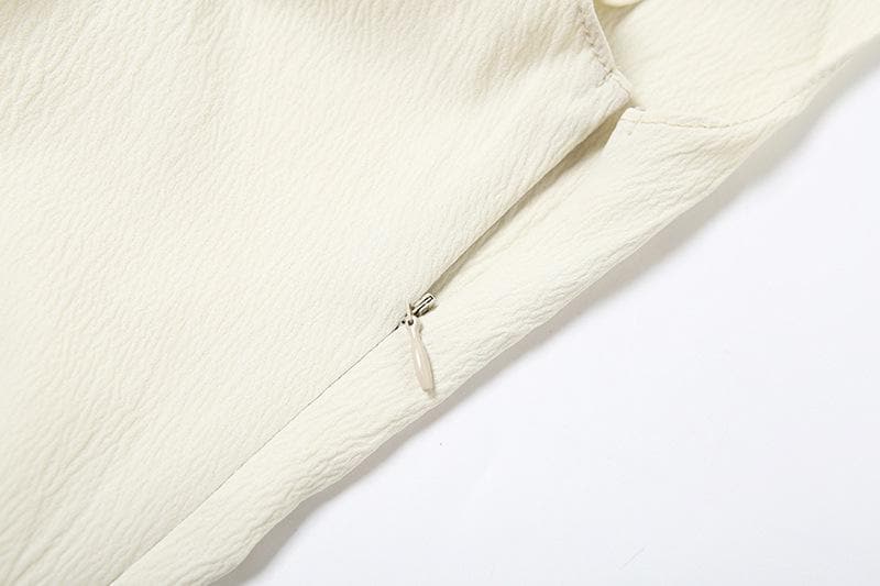 Off shoulder irregular solid zip-up top