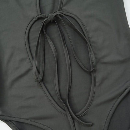 Hollow out long sleeve irregular self tie button bodysuit