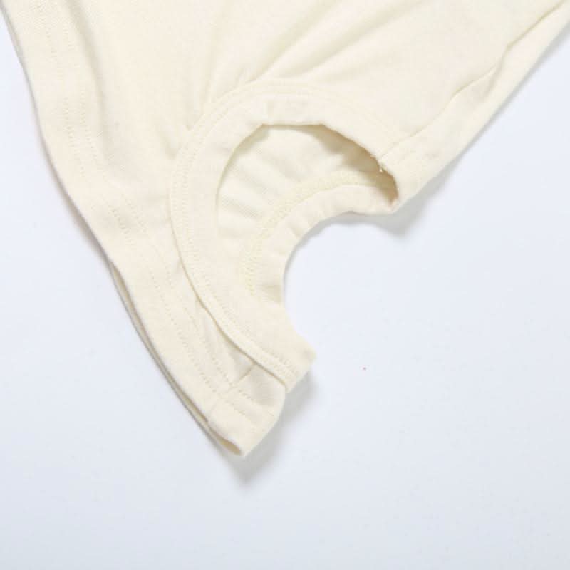 Crewneck irregular hollow out sleeveless solid cut out top